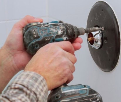 Can you replace shower fixtures without removing tile