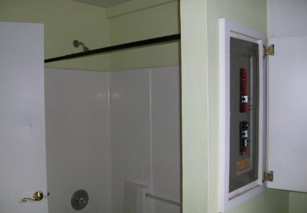Can a breaker box be in a bathroom wall
