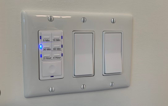 Can a fan isolator switch be in the bathroom