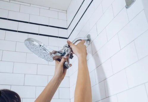 How do you remove a standard shower head from an apartment?