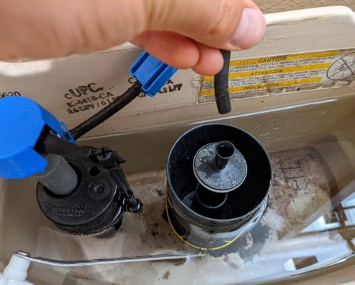 Toilet refill tube placement