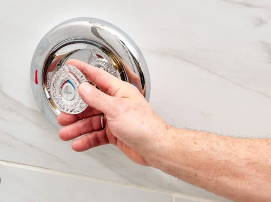 How do you remove a stubborn shower handle